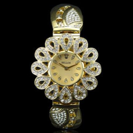 Très belle montre femme en métal doré avec des strass